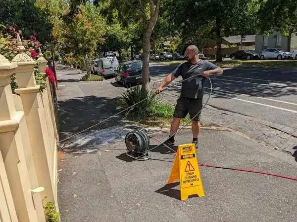 Plumber cleaning out a drain in Ashwood using jetter machine